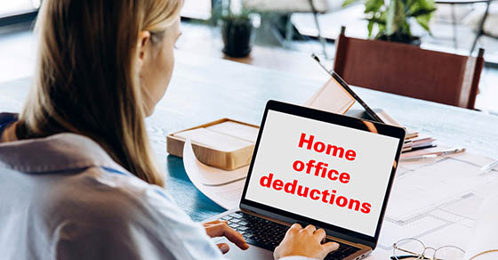 Woman working on a laptop trying to understand tax deductions for a home office